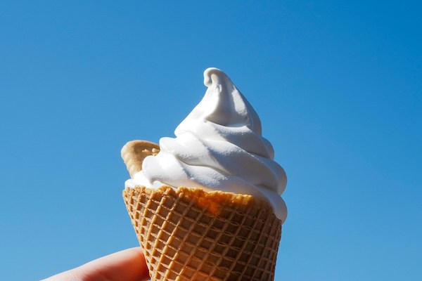person holding an ice cream cone