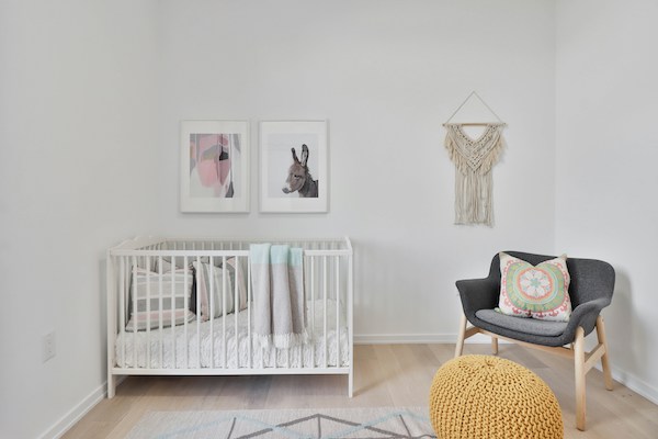baby nursery with crib and chair