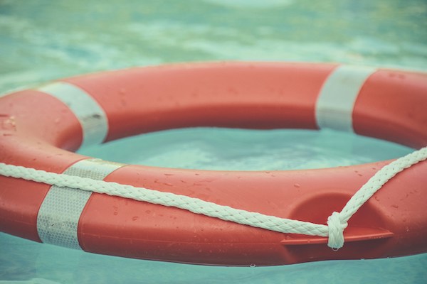 red and white buoy in a pool