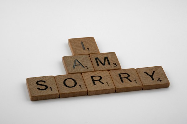 Scrabble tiles that spell, "I am sorry"