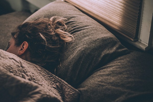 a woman asleep in bed