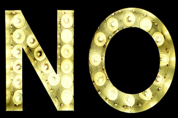 the word "no" lit up in yellow lights
