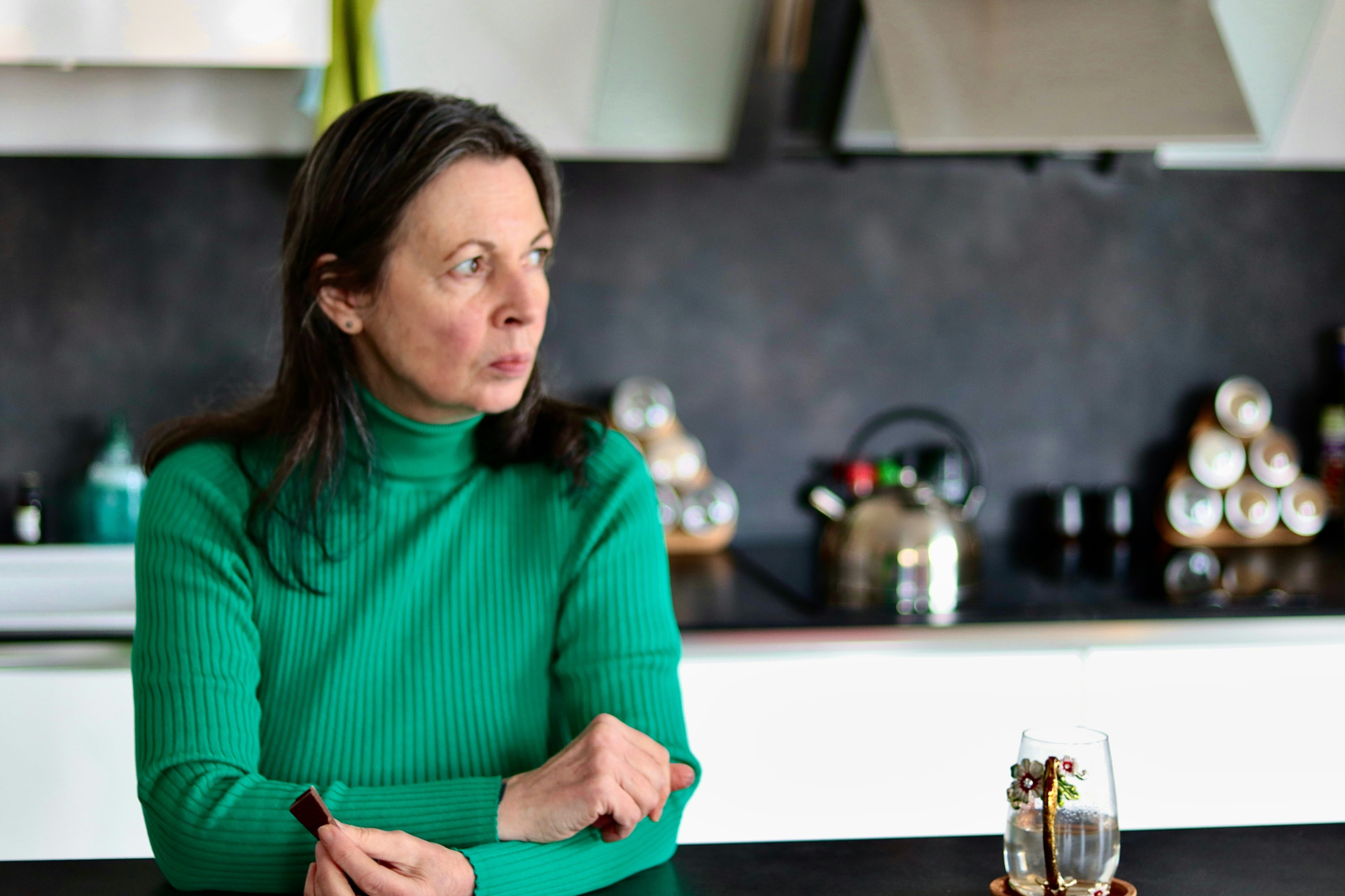 tense woman looking off to the side in thought